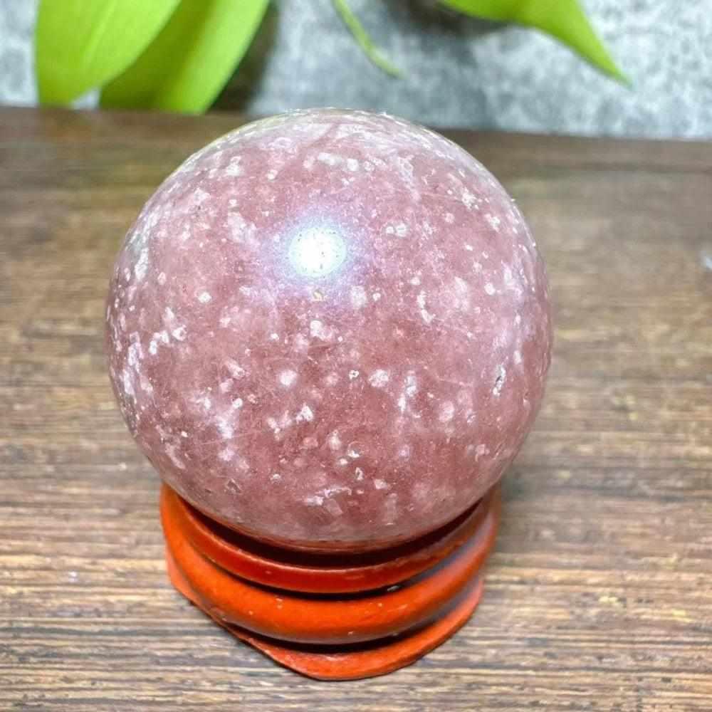 Polished 32mm Strawberry Quartz mini sphere with pink hues and white snowflake inclusions for Heart Chakra healing.