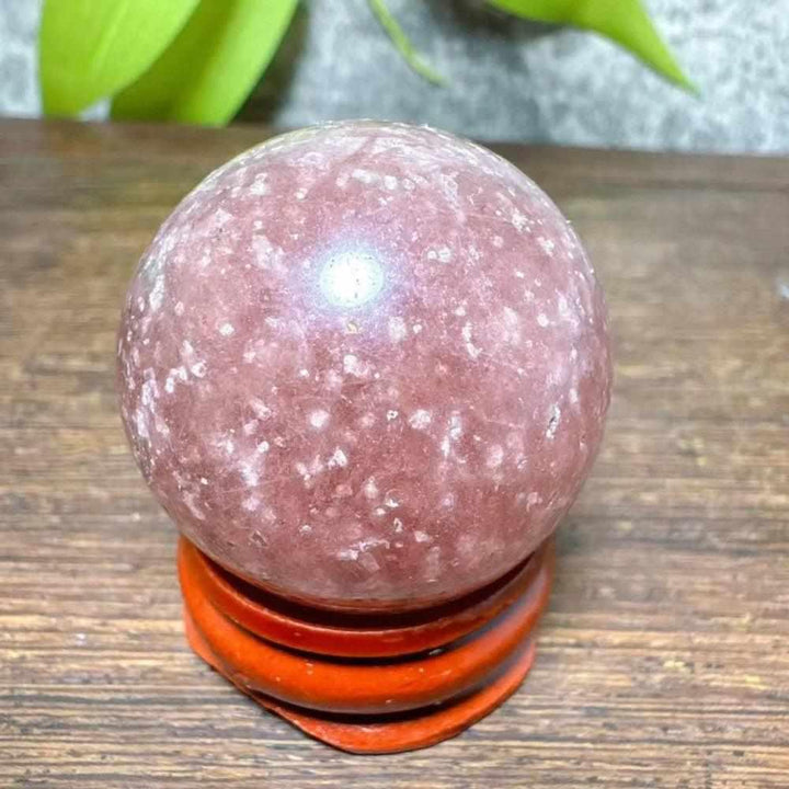Polished 32mm Strawberry Quartz mini sphere with pink hues and white snowflake inclusions for Heart Chakra healing.