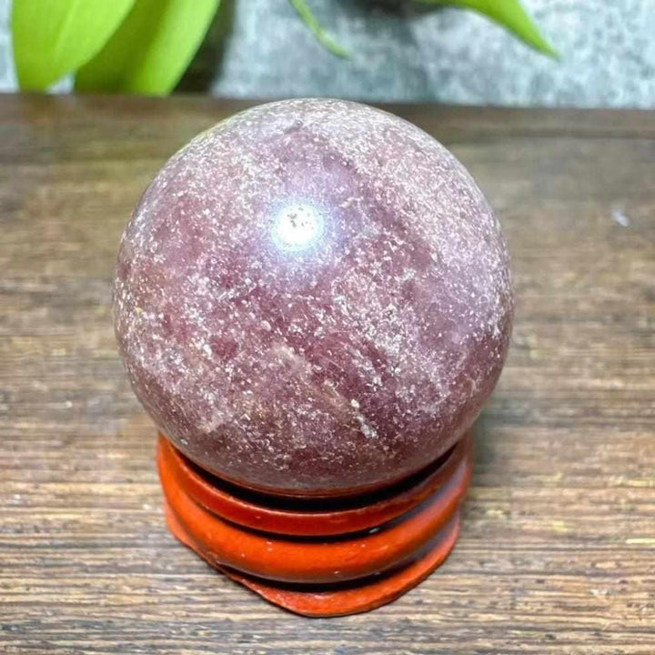 Polished 32mm Strawberry Quartz mini sphere with pink flecks and white snowflake clouds for heart chakra healing.