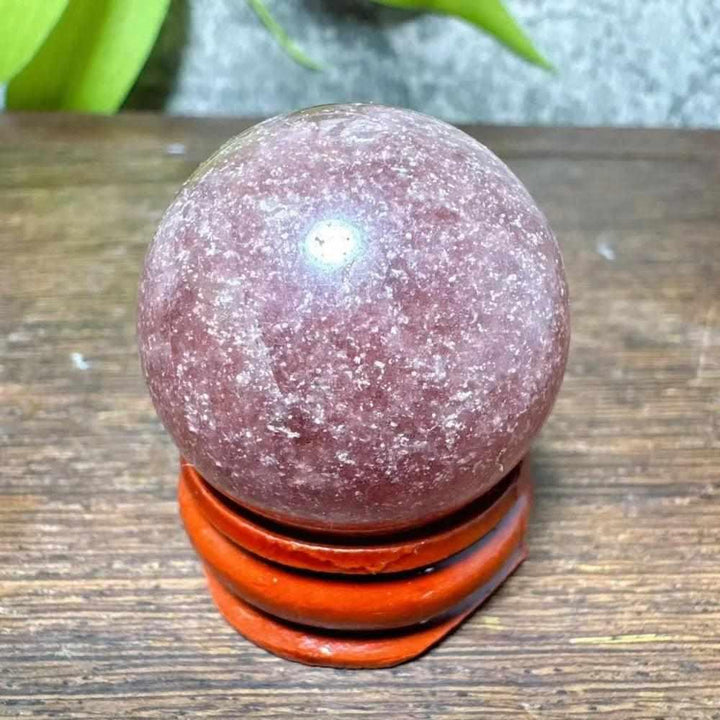 Polished 30-32mm Strawberry Quartz mini sphere with pink flecks and white snowflake clouds for Heart Chakra healing.