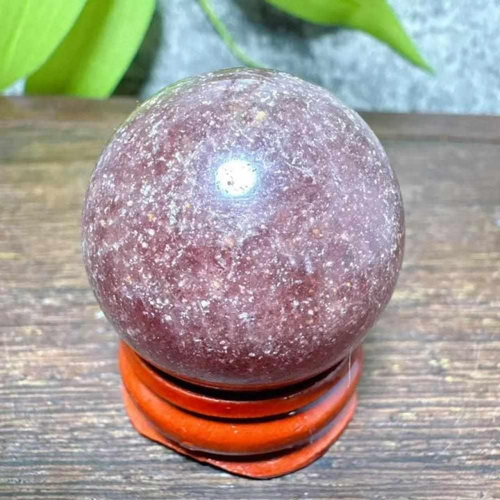 Polished 32mm Strawberry Quartz mini sphere with red, pink flecks and white snowflake clouds for Heart Chakra healing.