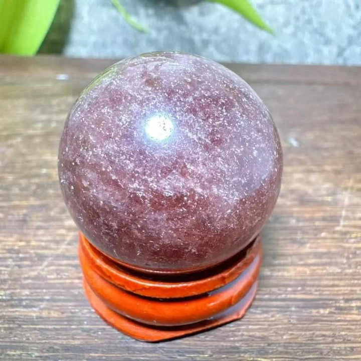 Polished 32mm Strawberry Quartz mini sphere with red flecks and white snowflake clouds for Heart Chakra healing.