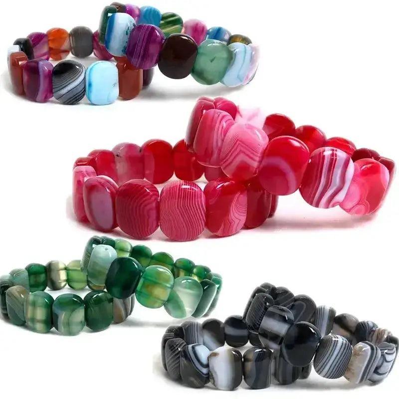 Striped Agate Botswana Onyx Bracelets with polished, banded natural stones in earthy tones, pink, green, and black.