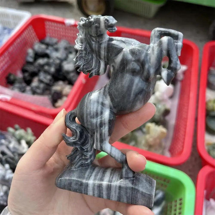 Hand-carved Taichi stone quartz horse sculpture featuring swirling black and white yin-yang patterns for grounding energy.