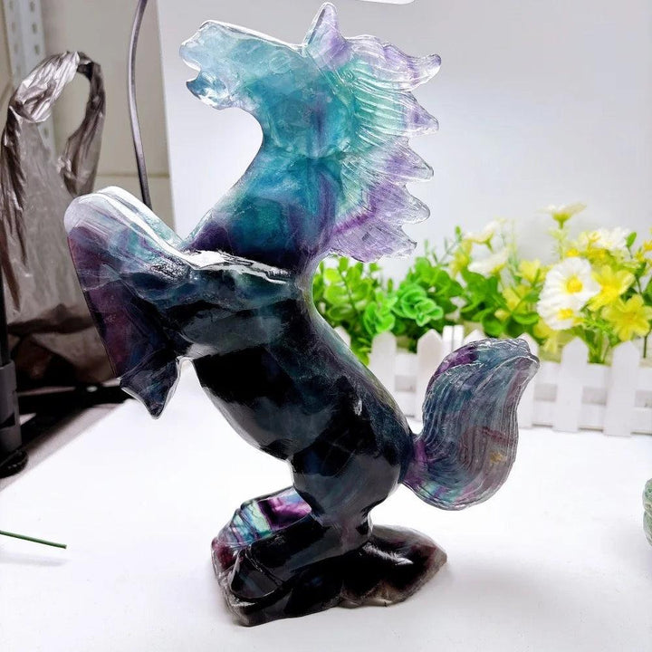 Tall fluorite crystal horse sculpture with vibrant green and purple banding, hand-polished for focus and clarity.