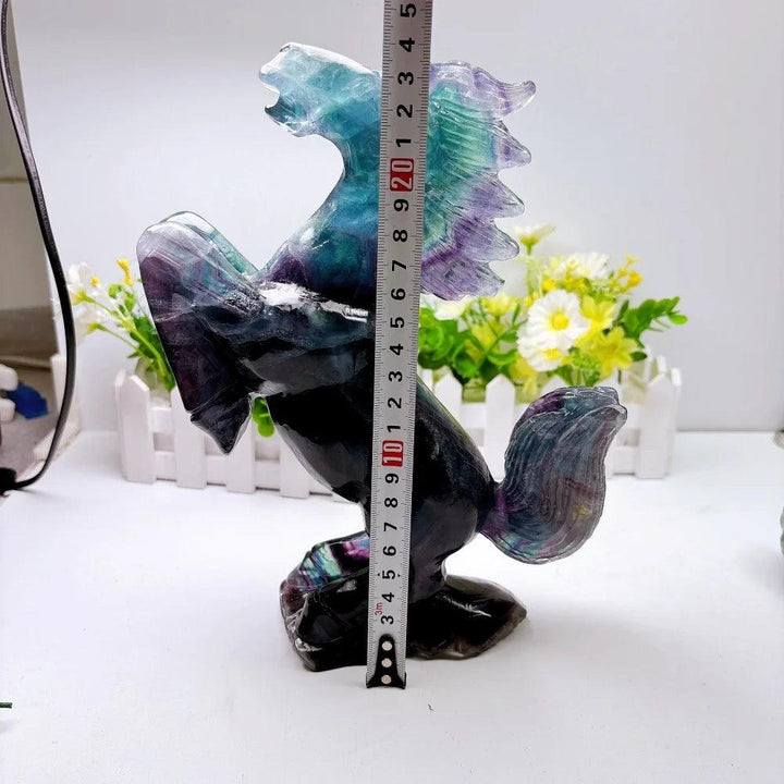 Hand-polished fluorite horse sculpture with vibrant green and purple banding, promoting mental clarity and focus.