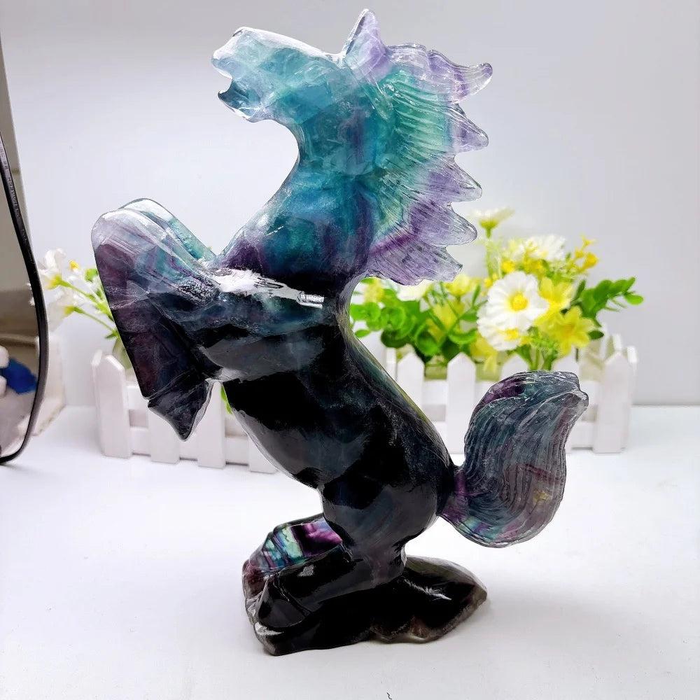 Hand-polished fluorite crystal horse sculpture with vibrant green and purple banding for focus and mental clarity.