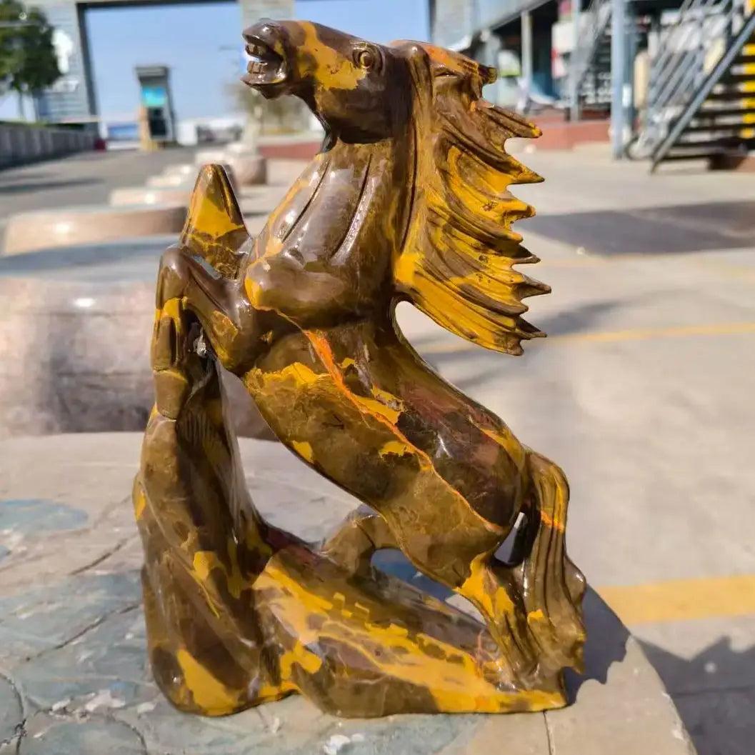 Polished Three-Flower Jasper flying horse statue with earthy brown and gold patterns for grounding root chakra energy.