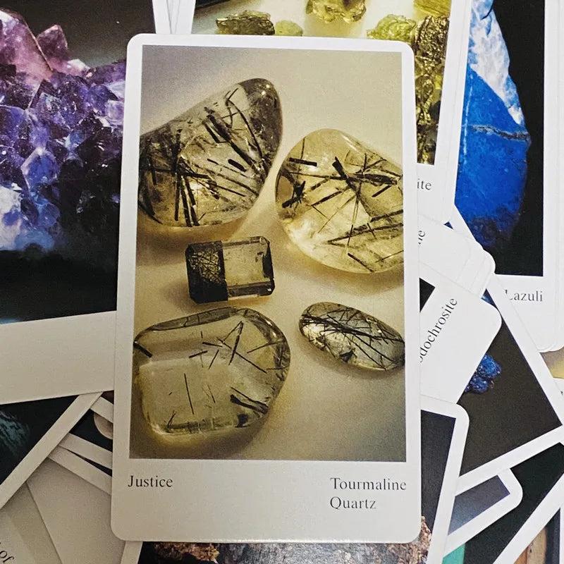 Tarot card featuring clear, polished tourmaline quartz with black needle inclusions, labeled "Justice.