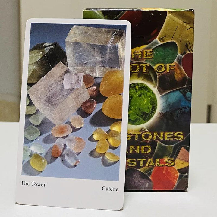 Tarot of Gemstones and Crystals "The Tower" card featuring clear and yellow calcite, with colorful deck box.