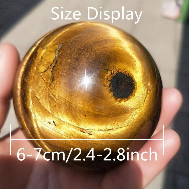 Polished 6-7cm natural Tiger Eye crystal sphere, a golden healing stone perfect for Reiki and elegant home decor.