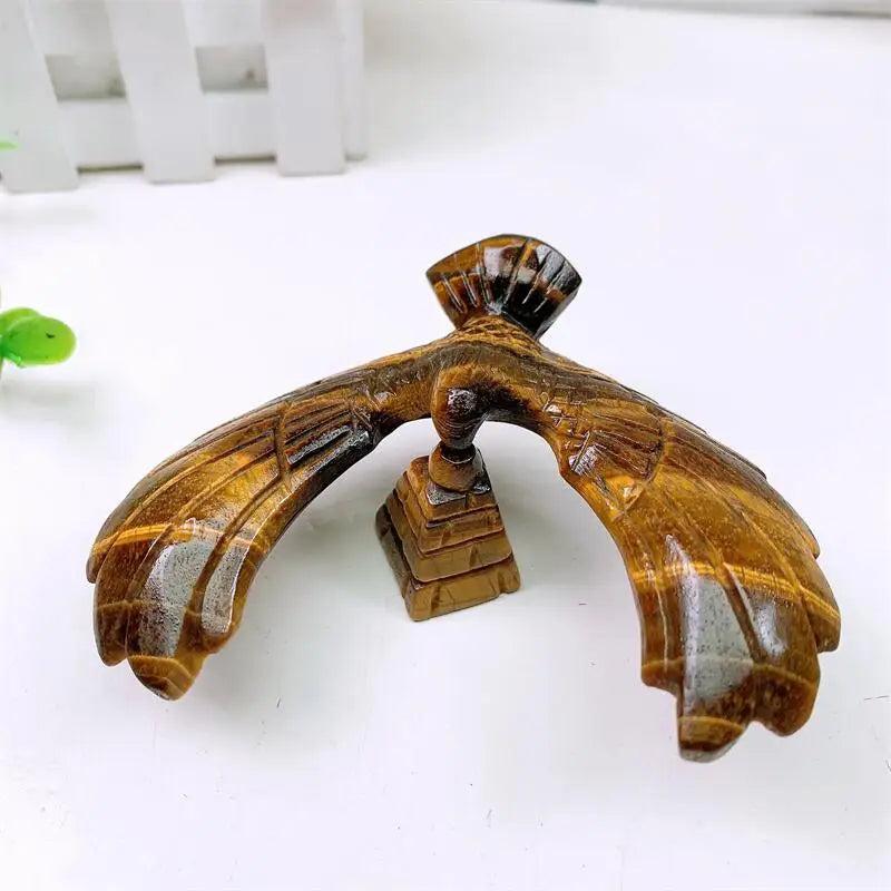 Hand-carved Tiger Eye spinning eagle statue balancing on a pyramid base for grounding, confidence, and manifestation.