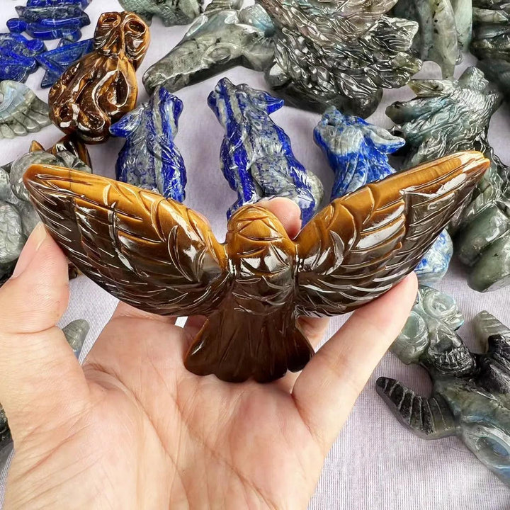 Hand-carved Tiger Eye eagle statue with golden chatoyant bands, perfect for grounding and Solar Plexus Chakra energy.