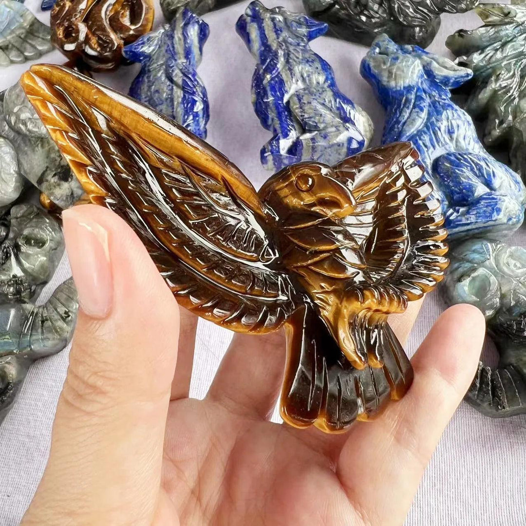 Hand-carved Tiger Eye eagle statue with golden chatoyant bands, perfect for confidence, grounding, and solar plexus energy.