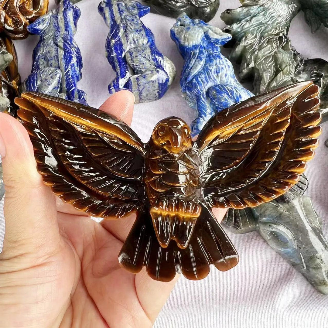 Hand-carved Tiger Eye eagle statue with golden chatoyant bands, perfect for confidence, grounding, and solar plexus energy.
