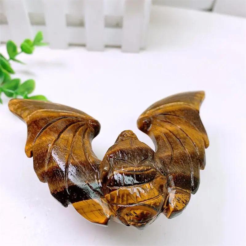 Tiger Eye Crystal Carved Spinning Bat with Pyramid Sculpture, showcasing warm golden chatoyancy for protection & confidence.