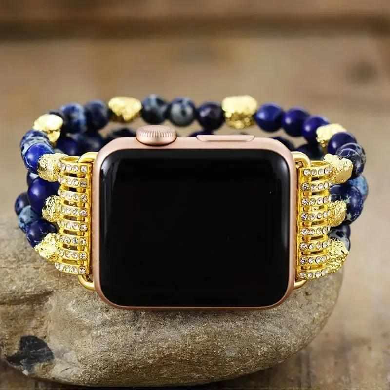 Emperor Jasper Beaded Crystal iWatch Band, featuring deep blue beads, gold accents, and a rose gold Apple Watch.