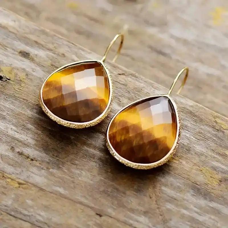 Sparkling Crystal Teardrop Dangle Earrings with faceted natural crystals in a gold setting, perfect for elegant style.