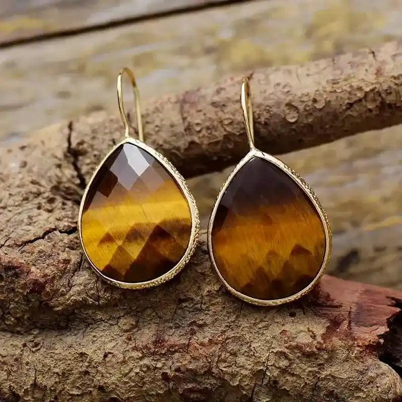 Sparkling Tiger's Eye Crystal Teardrop Dangle Earrings with gold-tone settings, offering timeless sophistication.