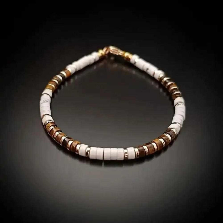Tiger's Eye and white stone disc bead bracelet with gold-tone spacers for grounded confidence and elegant style.