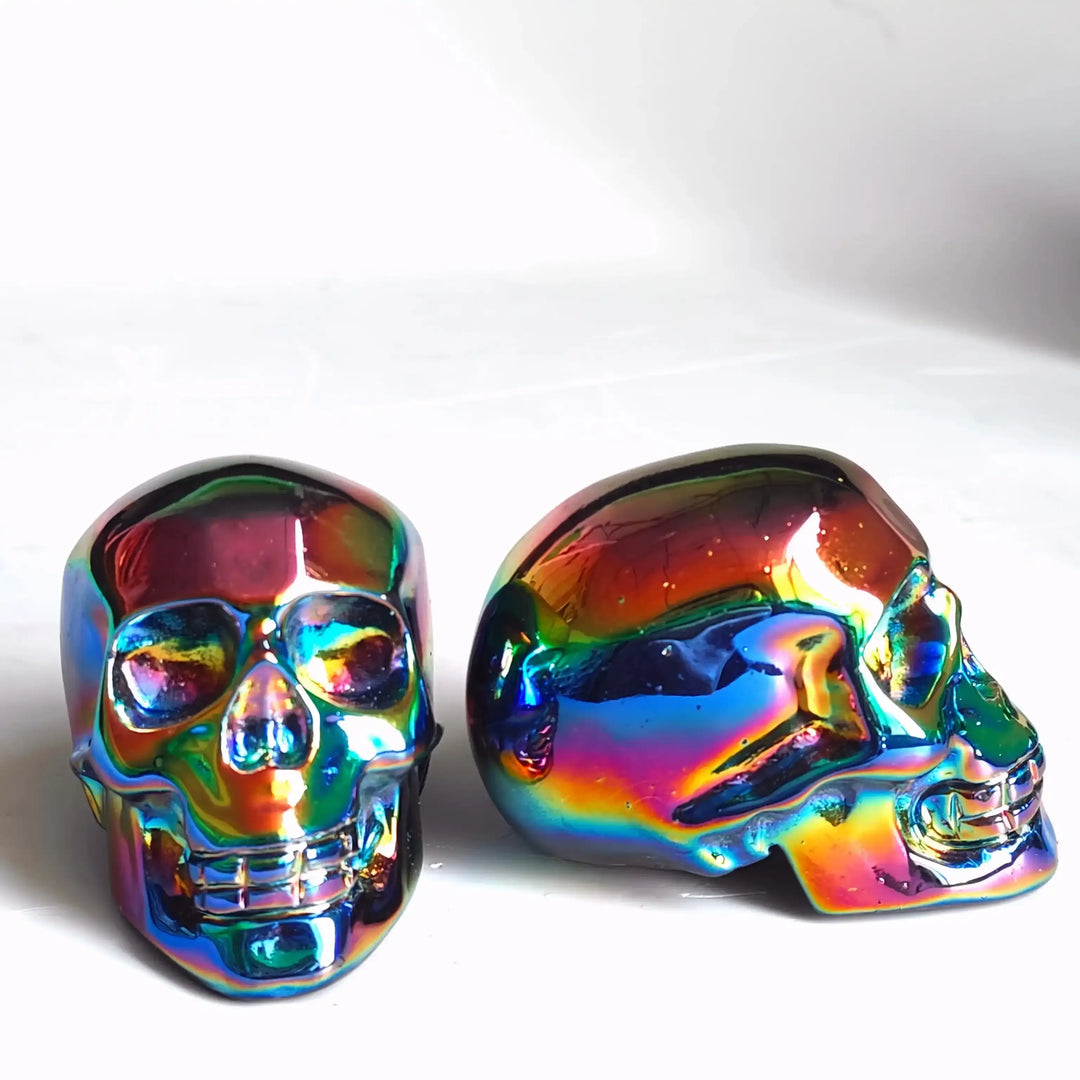 2.36'' Titanium Aura Obsidian skull carving with a vibrant, iridescent rainbow finish for unique home decor and energy.