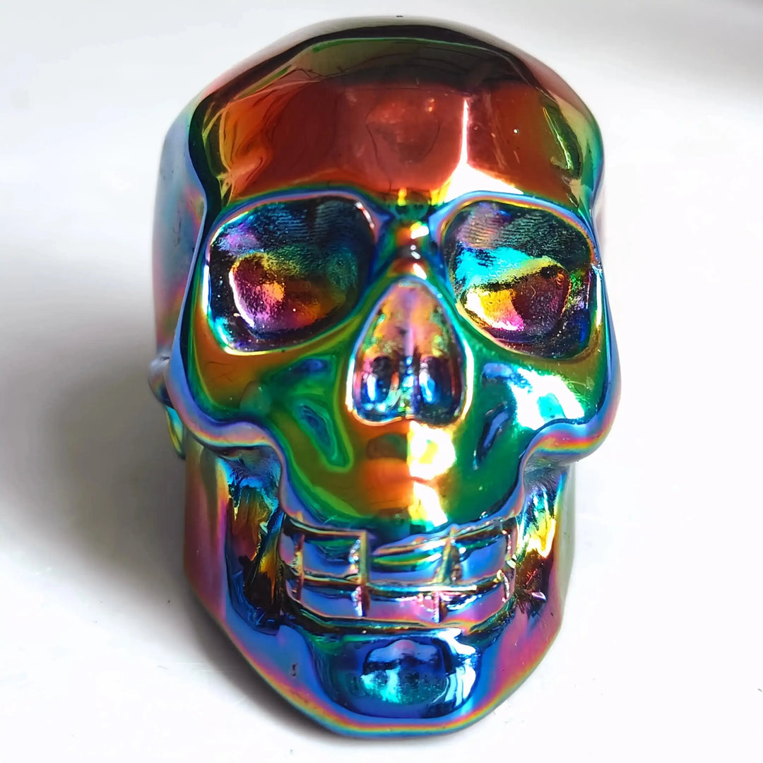2.36'' Titanium Aura Obsidian skull carving with a vibrant, iridescent rainbow finish for energy and protection.