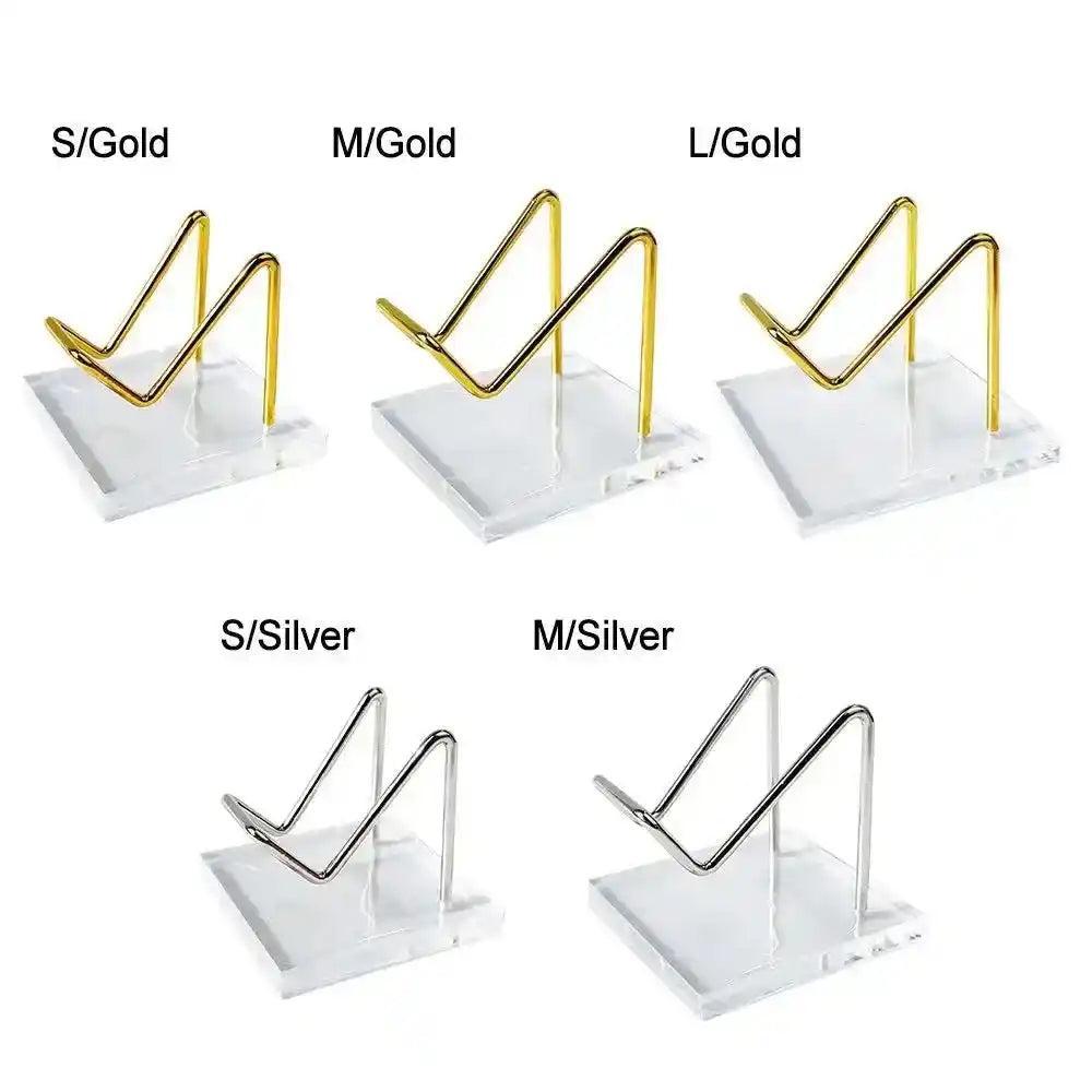 Transparent Acrylic Display Stands with gold and silver metal cradles in S, M, L sizes, perfect for crystals.