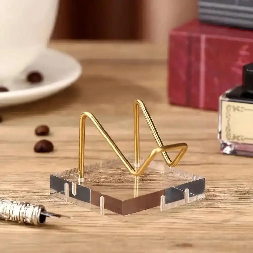 Transparent Acrylic Display Stand with gold wire holder, perfect for showcasing crystals and sacred objects.