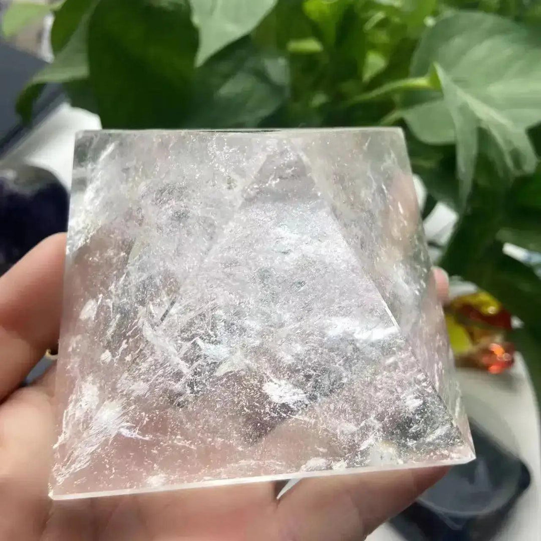 Polished transparent quartz crystal pyramid from Crystal Destiny, showcasing clarity and energetic presence.