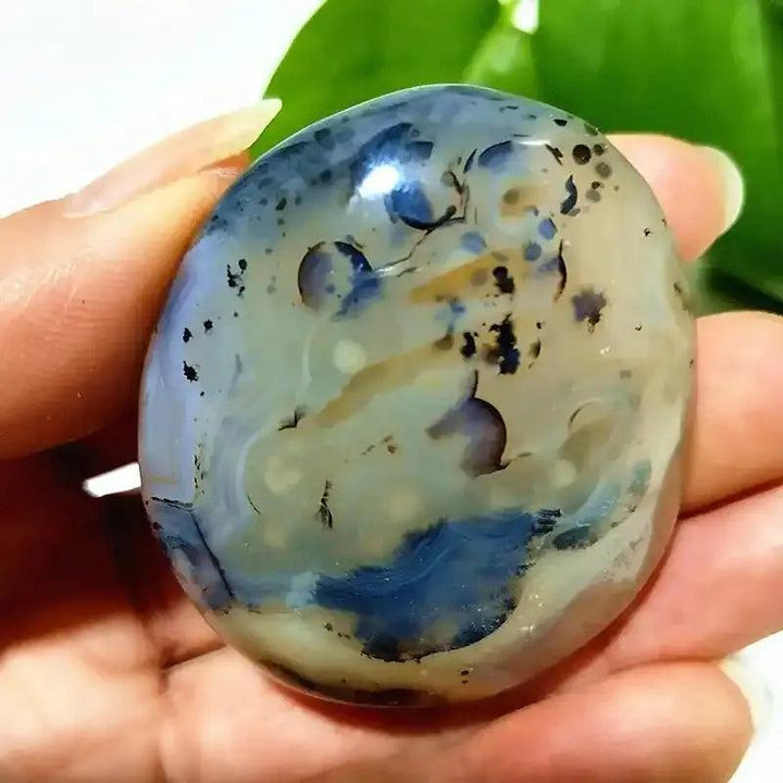 Smooth, hand-polished Tree Agate palm stone with cream and green branching patterns for grounding and steady growth.