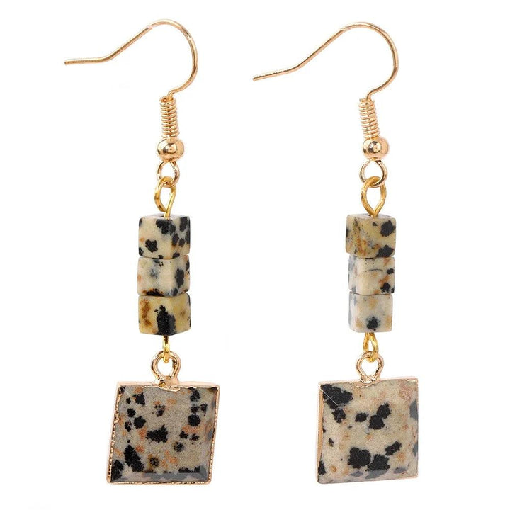 Trendy Square Stone Pendent Earring with natural Dalmatian Jasper, featuring speckled beige and black square stones on gold-tone hooks.