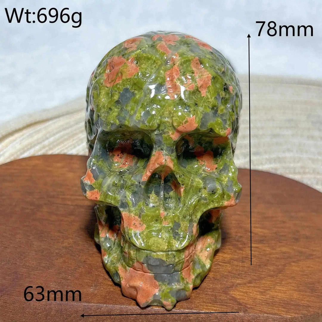 Hand-carved 696g Unakite crystal skull with green and pink healing stone patterns, perfect for Reiki or home decor.