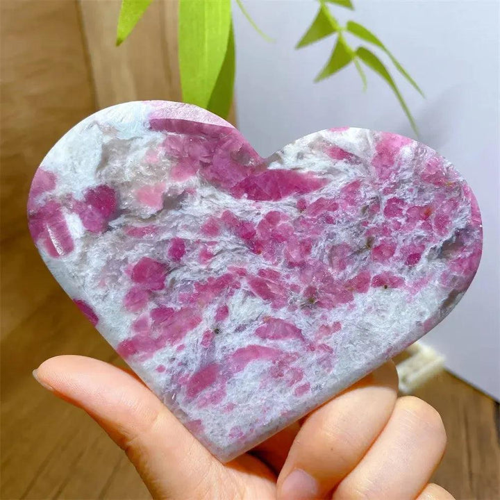 Hand-carved Unicorn Stone heart with swirling pink Tourmaline, smoky Quartz, and lavender Lepidolite.