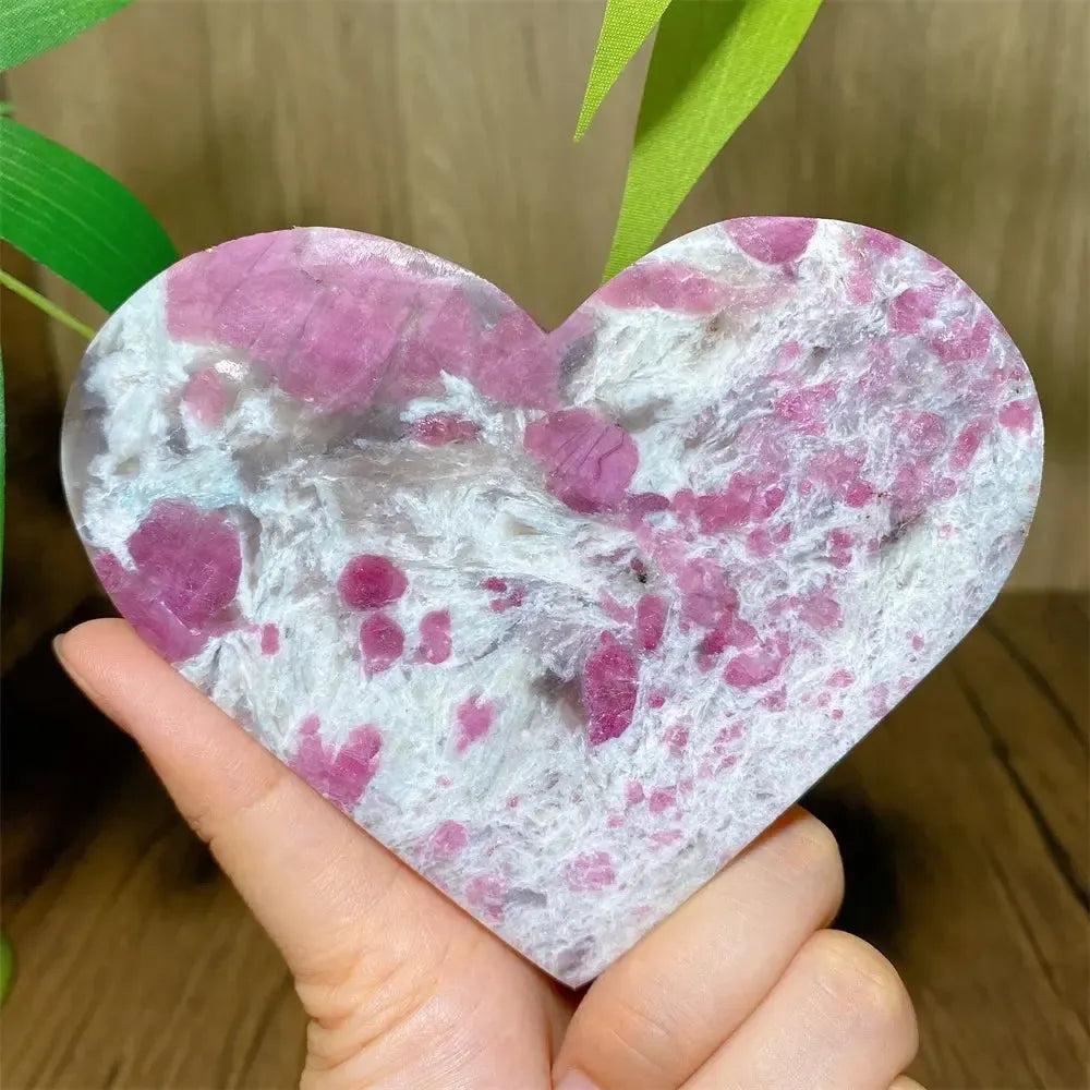 Polished Unicorn Stone heart with swirling pink Tourmaline, white Quartz, and lavender Lepidolite.