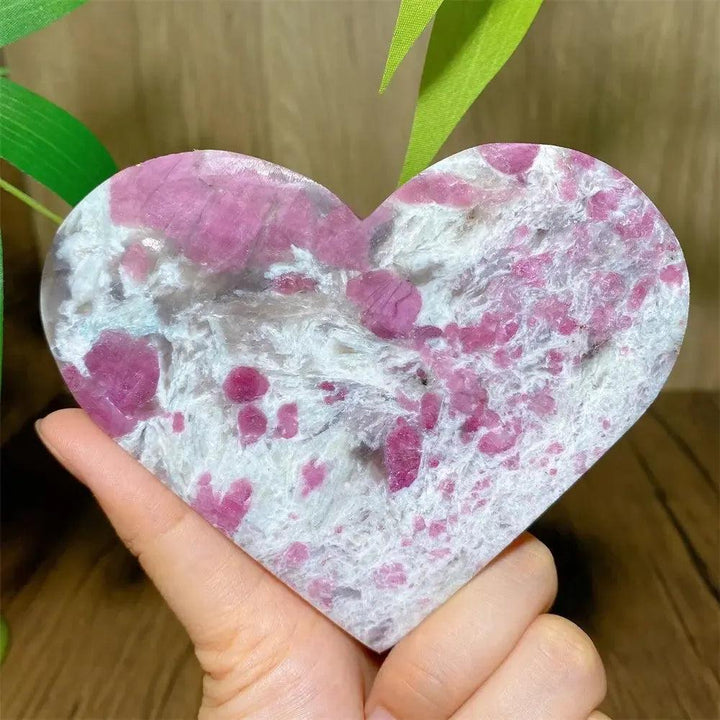 Polished Unicorn Stone heart with swirling pink Tourmaline, white Quartz, and lavender Lepidolite.