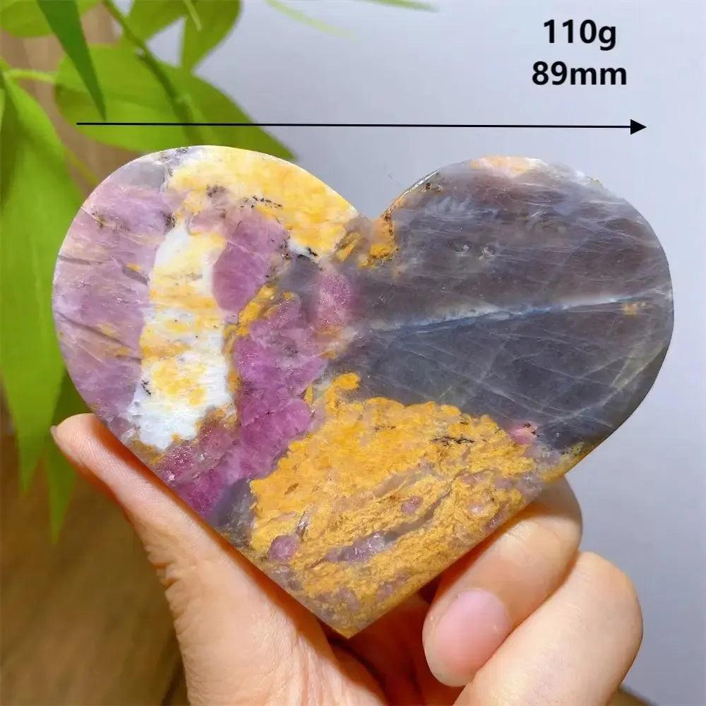 Polished Unicorn Stone heart, 110g, 89mm, with swirling pink, grey, purple, and gold patterns.