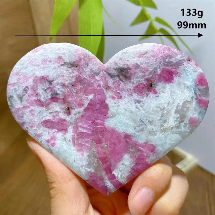 Hand-carved Unicorn Stone heart with swirling pink Tourmaline, grey Smoky Quartz, and lavender Lepidolite.