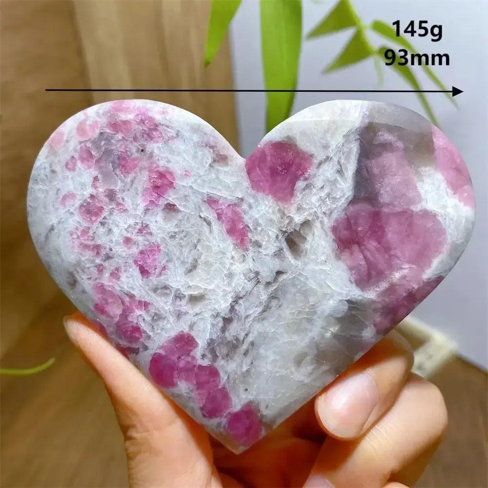 Hand-carved Unicorn Stone heart with swirling pink, grey, and purple patterns, weighing 145g and 93mm.
