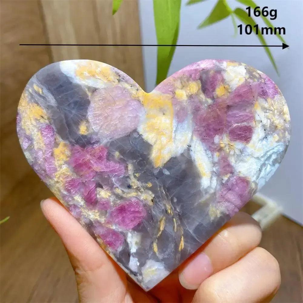 Hand-carved Unicorn Stone heart with swirling pink, grey, and purple hues, weighing 166g.