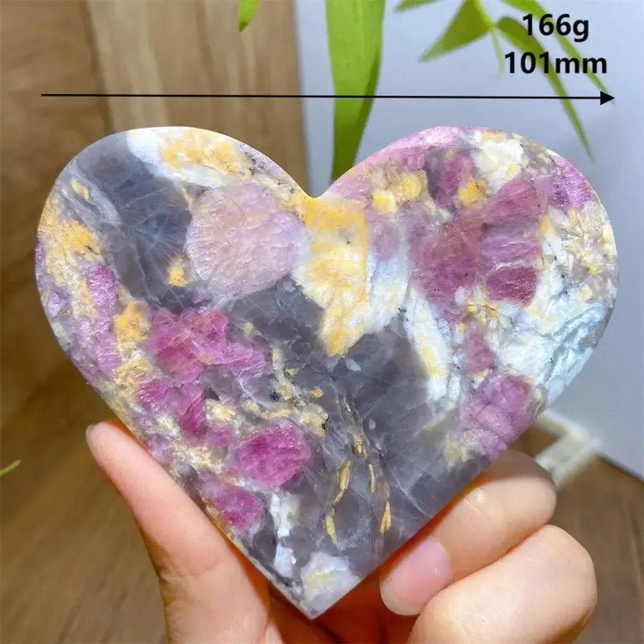 Hand-carved Unicorn Stone heart with swirling pink, grey, and purple hues, weighing 166g.