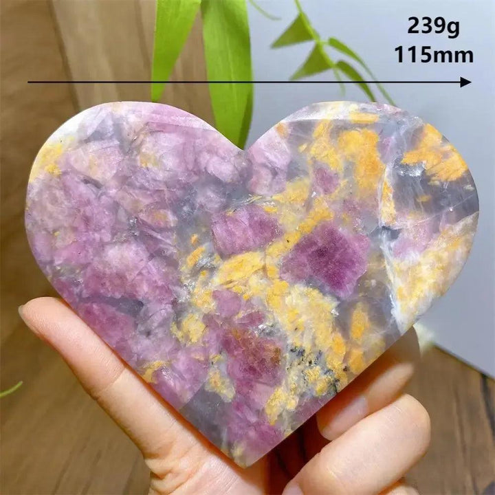 Hand-carved Unicorn Stone heart, 239g, 115mm, with swirling pink, grey, and purple patterns.