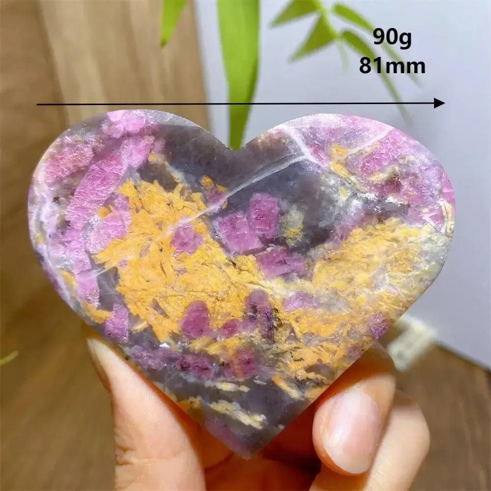 Unicorn Stone heart, 90g, 81mm, with swirling pink, grey, and yellow patterns.