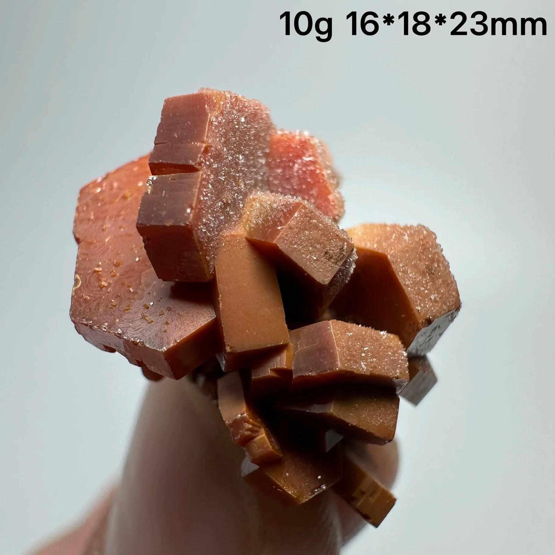 Vivid red hexagonal Vanadinite crystal specimen on matrix, perfect for Root Chakra energy and mineral collections.