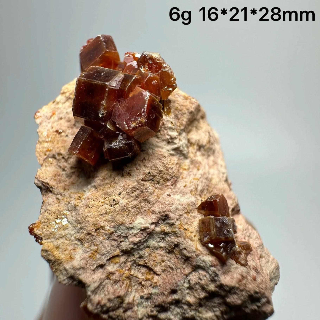 Vivid red hexagonal Vanadinite crystal specimen on a natural matrix, perfect for Root Chakra energy and display.