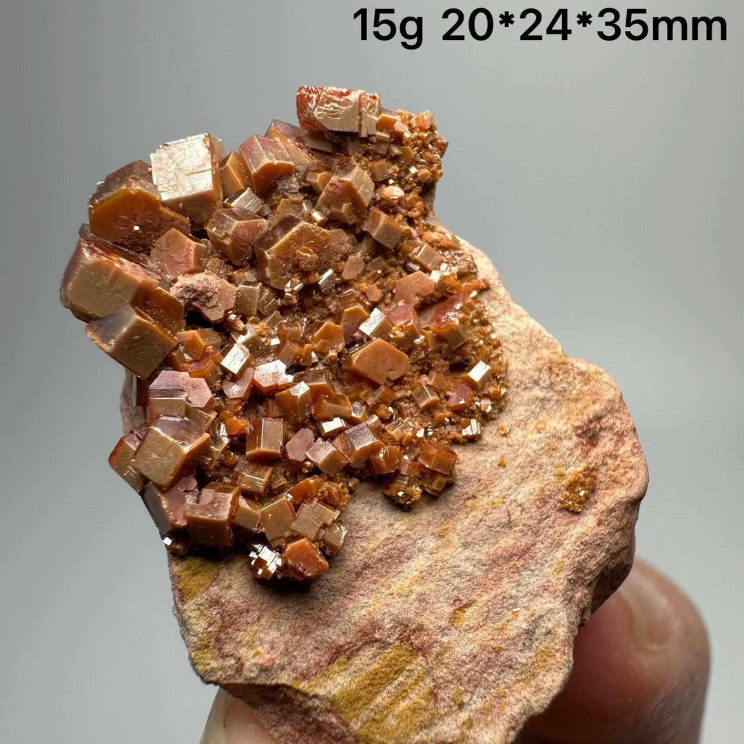Vivid red-orange hexagonal Vanadinite crystal specimen on natural matrix for Root and Sacral Chakra energy and display.