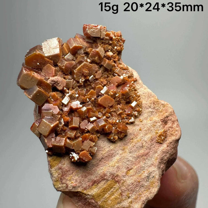 Vivid red-orange hexagonal Vanadinite crystal specimen on natural matrix for Root and Sacral Chakra energy and display.