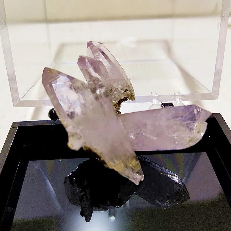 Raw Vera Cruz Amethyst cluster with pale, transparent lavender points for high-vibration spiritual healing and peace.