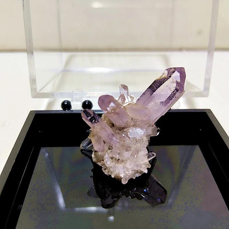 Raw Vera Cruz Amethyst cluster with pale lavender, high-clarity points for spiritual healing and high-vibration energy.