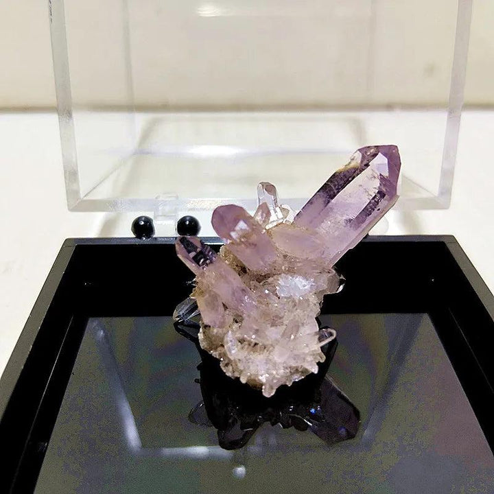 Raw Vera Cruz Amethyst cluster with pale lavender, high-clarity points for spiritual healing and high-vibration energy.