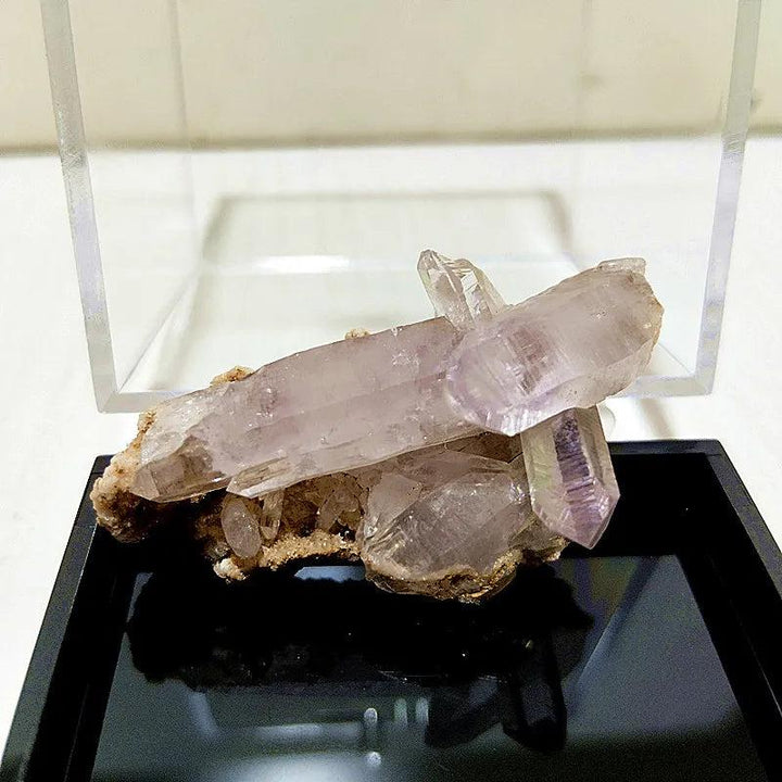 Raw Vera Cruz amethyst cluster with pale, transparent lavender points and natural terminations for spiritual healing.